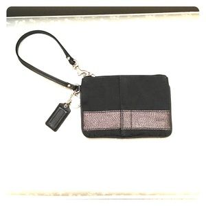 Black and silver Coach wristlet